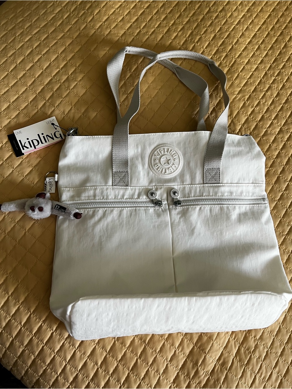 Kipling tote in rare alabaster color-14 W x14.5”H-Easy to clean nylon-NEW